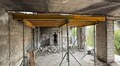 На Виговського, 77 відновлюють будинок, зруйнований ворожим ударом: вже реконструювали перекриття між 3 та 4 поверхами