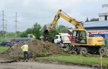 Фото 27: Ремонт вул. Хуторівка: підрядник стелить перший і другий шар асфальтобетону