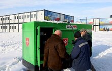 Фото 1: Замість трьох - одне зимове: як живуть мешканці найбільшого у Львові модульного містечка (відео)