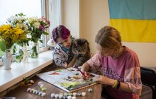 Фото 4: У Львові для переселенців та врятованих ними котів влаштували фотосесію
