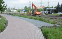 Фото 16: Ремонт вул. Хуторівка: підрядник стелить перший і другий шар асфальтобетону